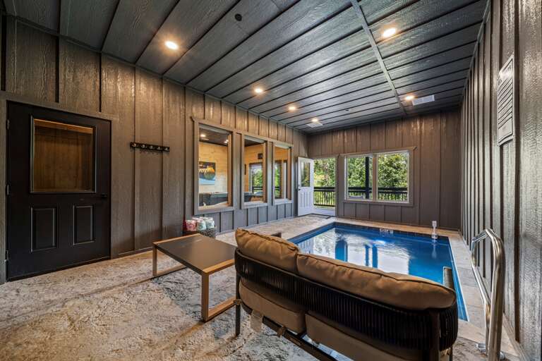 Glass windows connect the pool to the game room for nonstop entertainment
