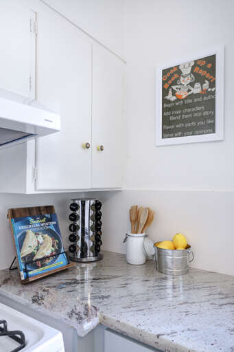 Modern Kitchen Interior With Marble Countertop And Wall Art