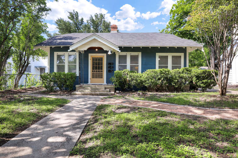 Single-story Suburban House With A Tree-lined Walkway