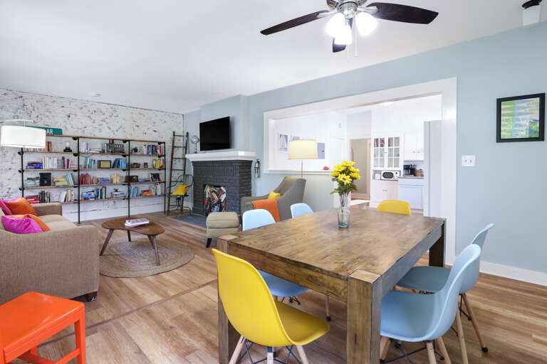 Modern Living Room With Colorful Furniture And Bookshelf