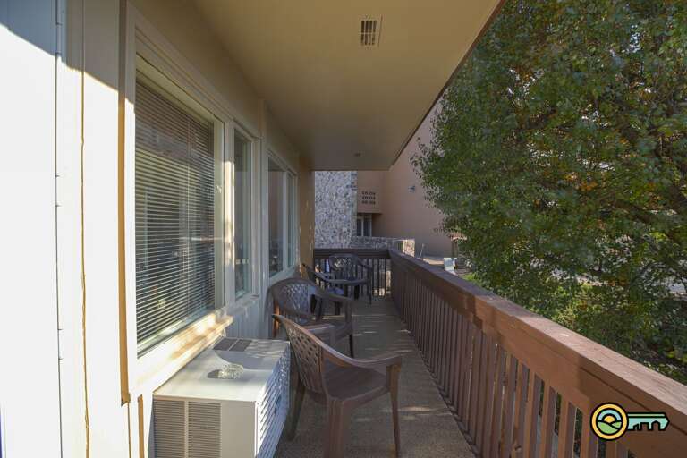 Balcony w/ view of pool on far end