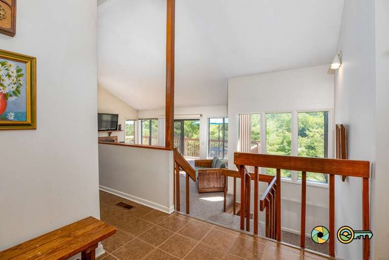 Interior Of A Bright Living Space With Stairs And Railing Interior Of A Bright Living Space With Stairs And Railing
