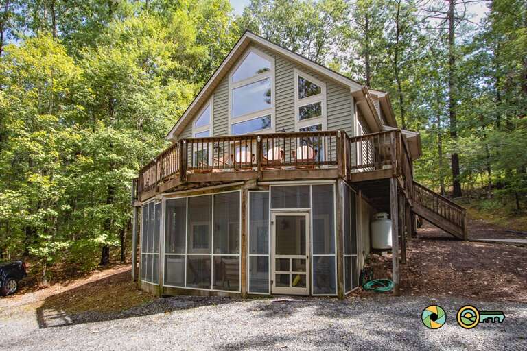 Cabin With Deck In Wooded Area Cabin With Deck In Wooded Area