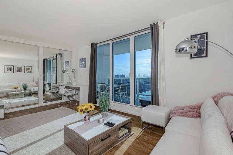 Modern Living Room With Balcony And City View Modern Living Room With Balcony And City View