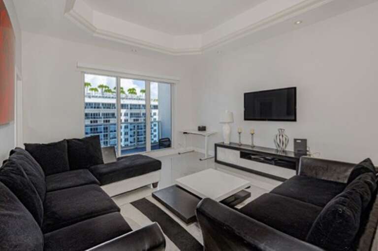 Modern Living Room With Black Sofas And City View Modern Living Room With Black Sofas And City View