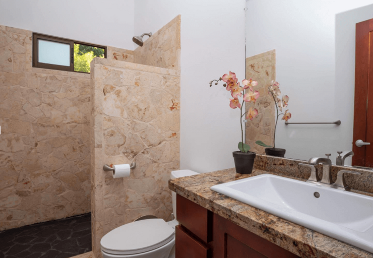 Modern Bathroom Interior With Marble Walls And Countertop