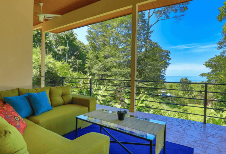 Balcony With Sofa Overlooking Forest And Sea