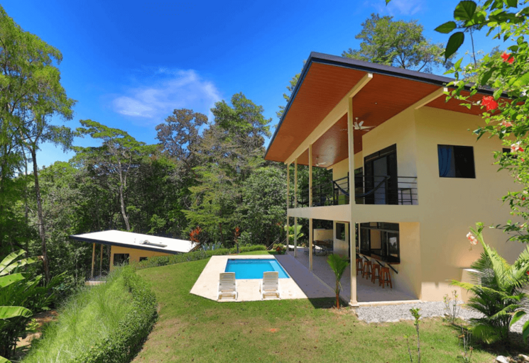 Modern Two-story Building With Pool In Tropical Setting