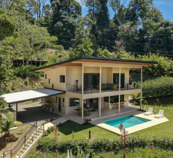Two-story House With Pool Surrounded By Greenery