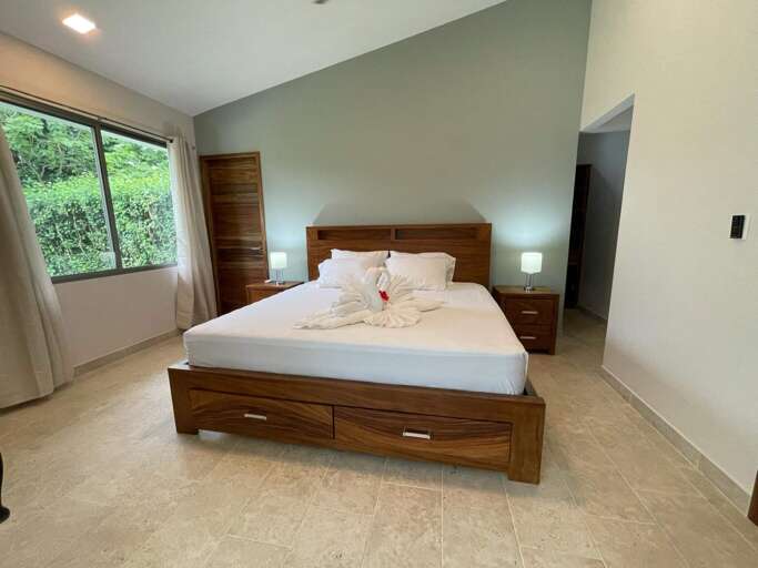 Modern Bedroom With Large Bed And Window View Modern Bedroom With Large Bed And Window View