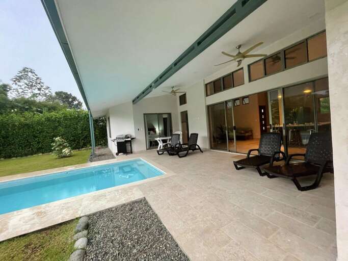Residential Poolside Patio With Loungers And Ceiling Fans Residential Poolside Patio With Loungers And Ceiling Fans