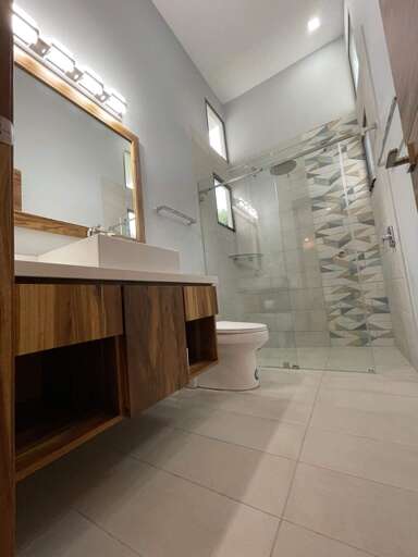 Modern Bathroom Interior With Glass Shower And Mirror Modern Bathroom Interior With Glass Shower And Mirror