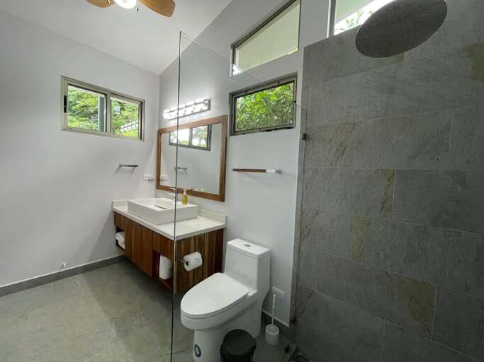 Modern Bathroom With Shower, Toilet, And Sink Modern Bathroom With Shower, Toilet, And Sink