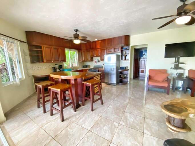Interior Of A Modern Kitchen With Dining Area And Adjacent Living Space