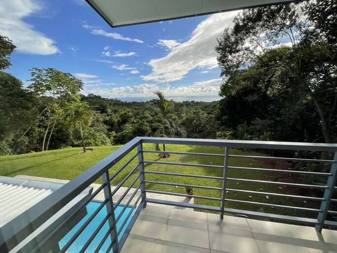 Balcony View Of Green Landscape And Pool Balcony View Of Green Landscape And Pool