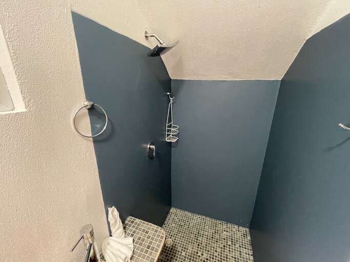 Modern Shower Corner With Gray Tiles And Wall-mounted Fixtures Modern Shower Corner With Gray Tiles And Wall-mounted Fixtures