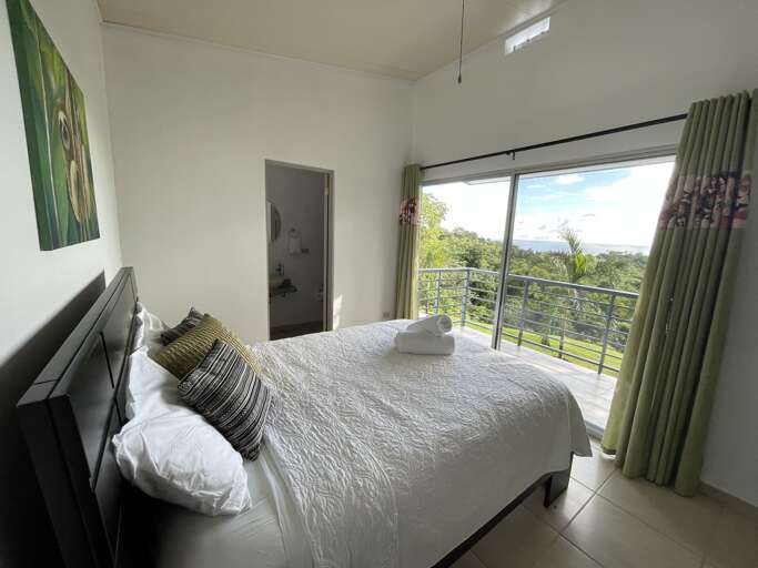 Modern Room With Bed And View Of Greenery Through Glass Door Modern Room With Bed And View Of Greenery Through Glass Door