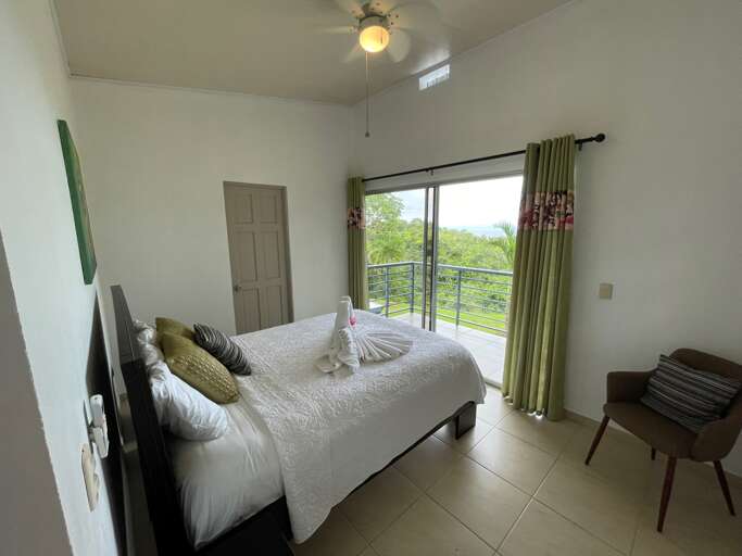Bedroom With Double Bed And Balcony Overlooking Green Landscape Bedroom With Double Bed And Balcony Overlooking Green Landscape