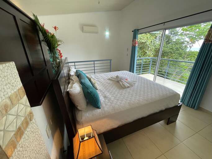 Modern Bedroom With Large Window And Tropical View Modern Bedroom With Large Window And Tropical View