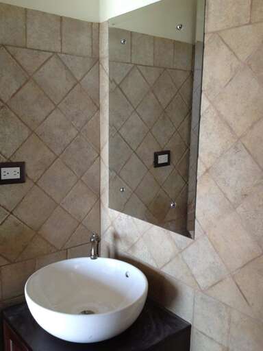 Bathroom With Sink And Mirror