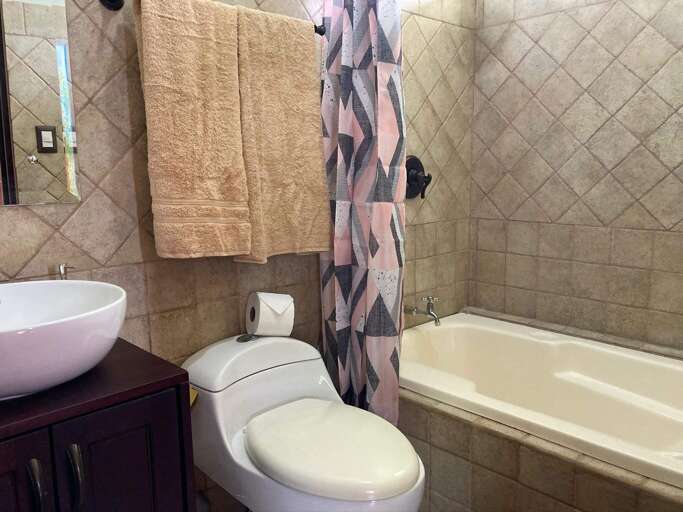 Bathroom With Toilet, Bathtub, And Sink