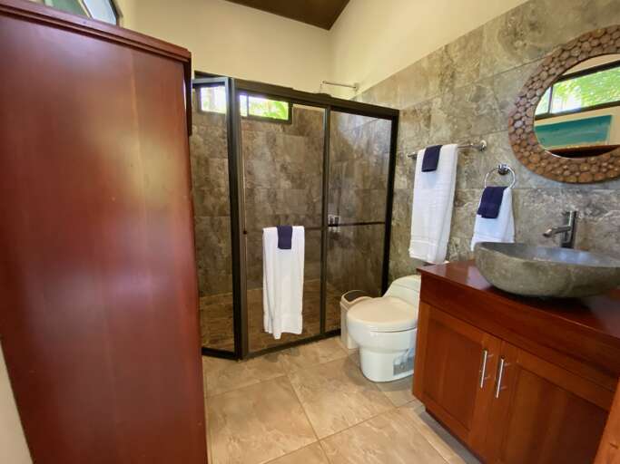 Modern Bathroom With Shower, Toilet, And Sink Modern Bathroom With Shower, Toilet, And Sink