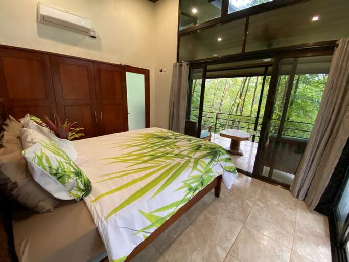 Room Interior With Bed And View To Greenery Outside Room Interior With Bed And View To Greenery Outside