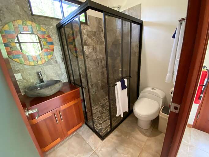 Modern Bathroom With Shower, Sink, And Toilet Modern Bathroom With Shower, Sink, And Toilet