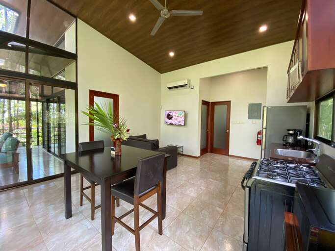 Modern Kitchen Interior With Dining Area And Sliding Glass Doors Modern Kitchen Interior With Dining Area And Sliding Glass Doors