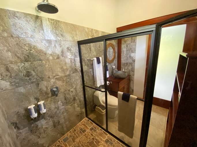 Modern Bathroom With Glass Shower Door And Tiled Walls Modern Bathroom With Glass Shower Door And Tiled Walls