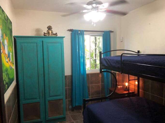 Interior Of A Room With Bunk Bed, Wardrobe, And Curtains Interior Of A Room With Bunk Bed, Wardrobe, And Curtains
