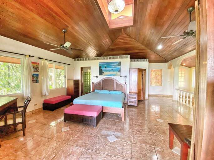 Interior View Of A Room With Beds, Wooden Ceiling, And Tiled Floor Interior View Of A Room With Beds, Wooden Ceiling, And Tiled Floor