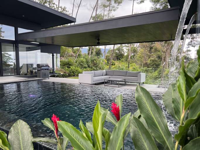 Modern House With Pool And Sectional Sofa Outdoors