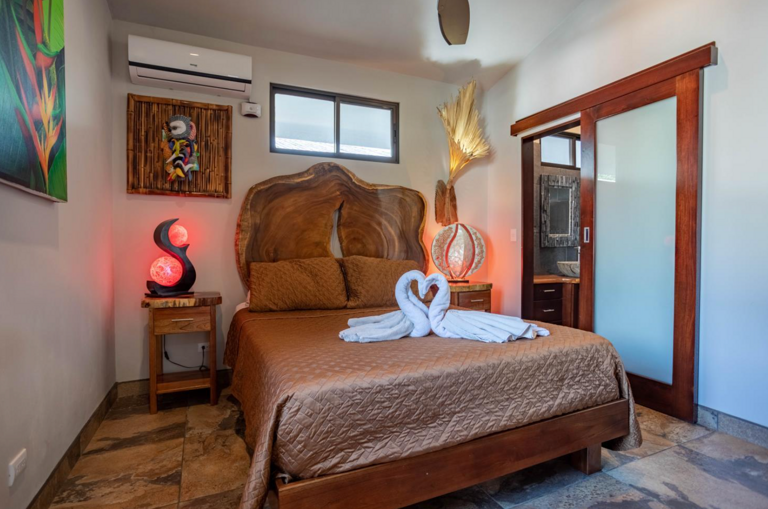 Cozy Bedroom With Wooden Furniture And Decorative Lighting Cozy Bedroom With Wooden Furniture And Decorative Lighting