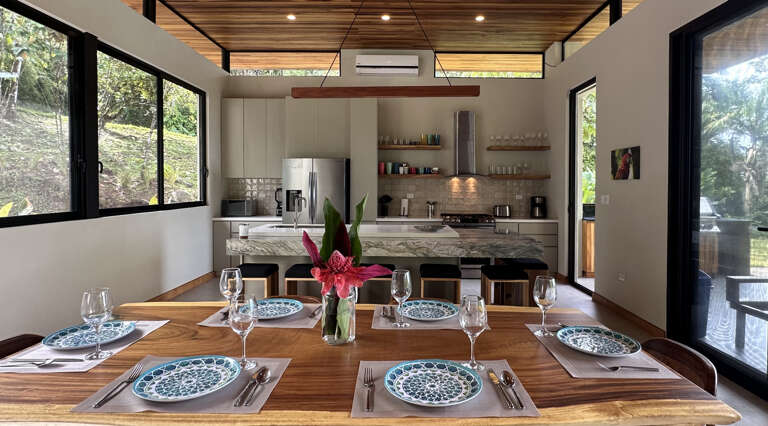 Modern Kitchen Interior With Dining Table And Large Windows Modern Kitchen Interior With Dining Table And Large Windows
