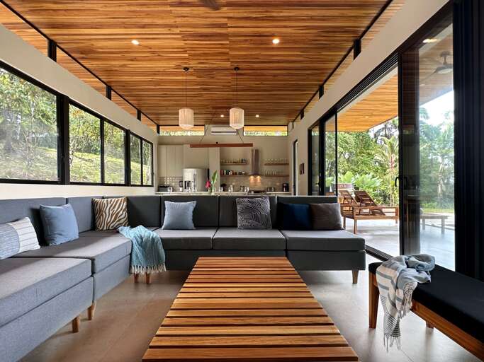 Modern Living Room With Kitchen And Wooden Ceiling Modern Living Room With Kitchen And Wooden Ceiling