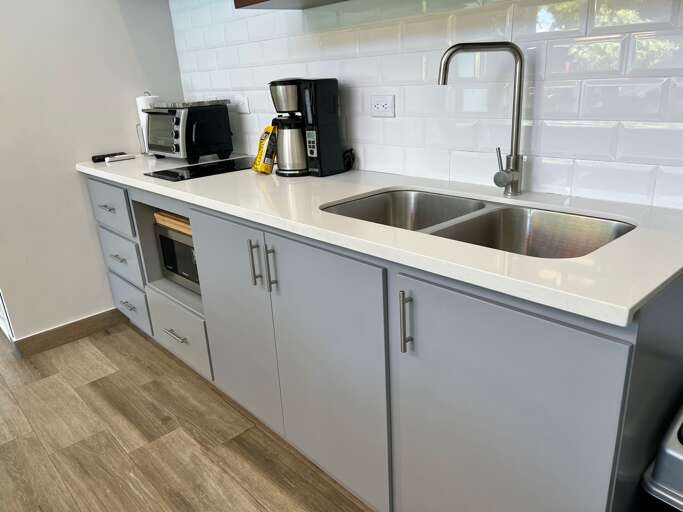 Modern Kitchen Counter With Sink And Appliances