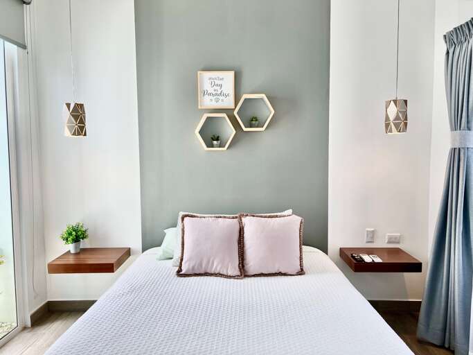 Modern Bedroom With Double Bed And Decorative Wall Items