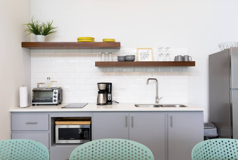Modern Kitchen Interior With Appliances And Floating Shelf