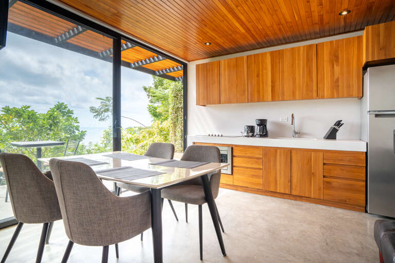 Modern Kitchen Interior With Dining Area And Scenic View