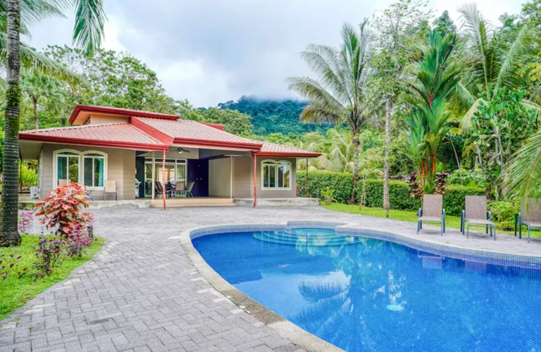 Single-story House With Swimming Pool And Tropical Vegetation