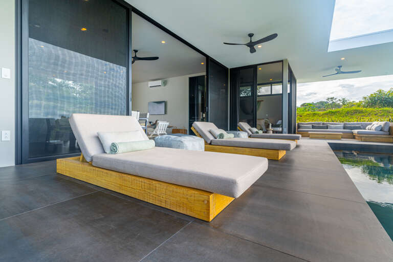 A relaxing space with comfy seating, ideal for enjoying the poolside ambiance.
 A relaxing space with comfy seating, ideal for enjoying the poolside ambiance.