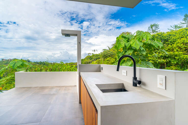 A poolside grilling area, where you can cook and enjoy meals with a refreshing view. A poolside grilling area, where you can cook and enjoy meals with a refreshing view.