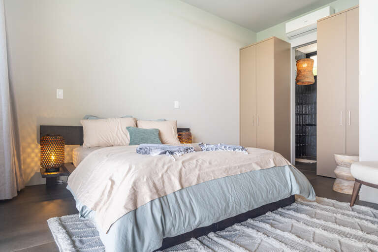 A spacious, modern bedroom with elegant design, featuring a luxurious bed for ultimate relaxation and a peaceful atmosphere. A spacious, modern bedroom with elegant design, featuring a luxurious bed for ultimate relaxation and a peaceful atmosphere.