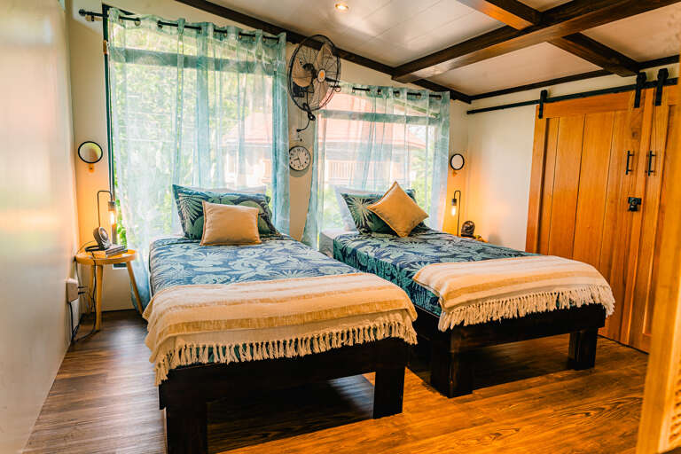 room2: A tranquil bedroom with two comfortable beds, creating a peaceful atmosphere for rest room2: A tranquil bedroom with two comfortable beds, creating a peaceful atmosphere for rest