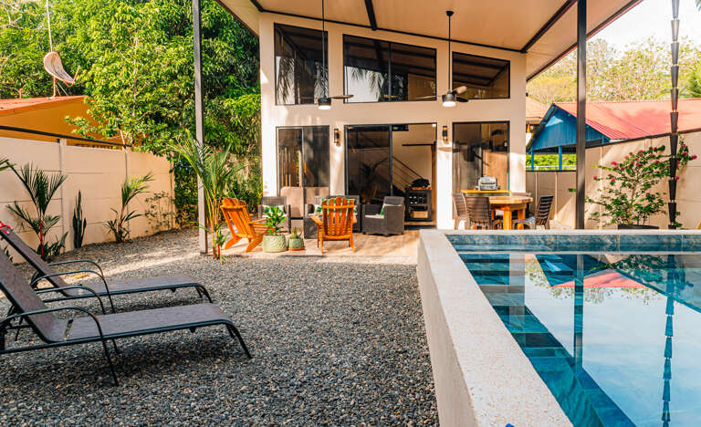 A stylish home with a refreshing pool and cozy outdoor area A stylish home with a refreshing pool and cozy outdoor area