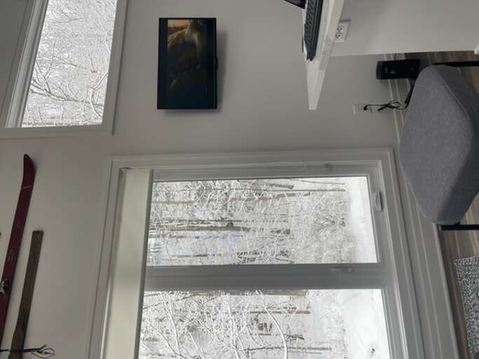 Interior Room With Window View Of Snowy Landscape Interior Room With Window View Of Snowy Landscape