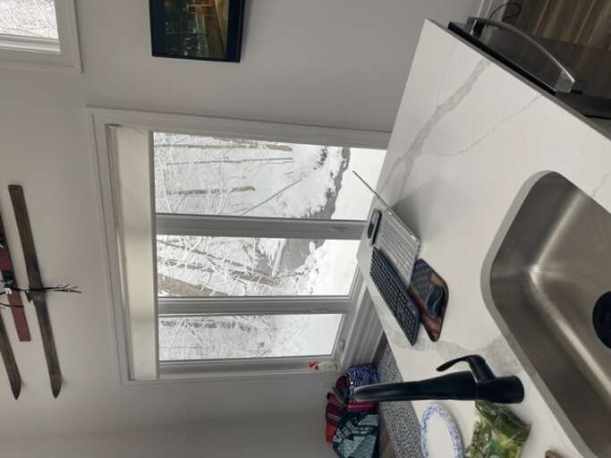 Kitchen Interior With Sink And Window Showing Snowy Landscape Kitchen Interior With Sink And Window Showing Snowy Landscape