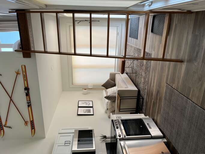 Modern Interior With Ladder To Loft And Kitchen Area