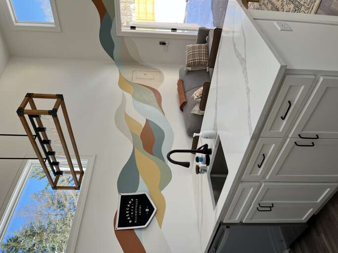 Modern Kitchen With Decorative Wall And High Ceiling